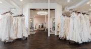 Brides take a walk through the “WOW” space, ready to say yes and fall in love with every view of themselves in their dress. This alcove has mirrors on all sides for the perfect sparkly view and a shimmering statement chandelier with the signature hint of Sophia’s floral.
